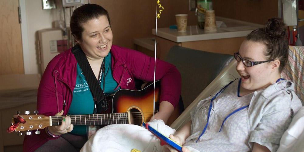 music therapy: child life specialist with patient